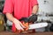 Cleaning and maintenance of the chainsaw by a person on a table