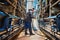 Cleaning off the factory floor. Full length shot of a male farmer hosing off the floor inside a dairy factory.