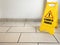 Cleaning in progress caution yellow sign on office floor