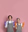 Cleaning Service Ad. Happy Couple In Protective Rubber Gloves Pointing Upwards