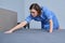 Cleaning service in hotel room, woman maid preparing guest room making bed