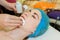 Cleaning the skin of a young girl`s face from a beautician. The girl at the beautician does facial cleansing and facial