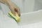 Cleaning with sponge scouring pad closeup