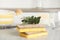 Cleaning sponges for dish washing and eucalyptus branch on grey marble table, closeup