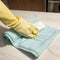 Cleaning with spray detergent rubber gloves and dish cloth on work surface concept for hygiene