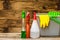 Cleaning sprayer anti bacterial sanitizer spray isolated with mop bucket and yellow gloves, concept of infection control.  Plastic