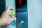 Cleaning staff Cleaned elevator switch button with alcohol spray in hospital or building office or condominium