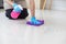 Cleaning staff is wiping cloth with cleaner and disinfectant on the surface of floor to make the floor clean with cleaning