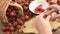 Cleaning strawberries in small bowl. wooden table. jam making.