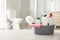 Cleaning supplies and toilet bowl in bathroom