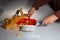 Cleaning up wooden chips with brush and dustpan