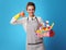 Cleaning woman with a basket with detergents and brushes