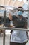 A cleaning worker wearing protective mask clean a glass in a terrace in a hotel in Mallorca vertical