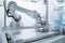 cleanroom with robotics arm performing inspection of high-tech medical device