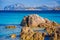 Clear amazing azure coloured sea water on Capriccioli beach with granite rocks, Sardinia, Italy