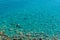 Clear azure water of the Adriatic sea near the shore. Arial view of the coast.