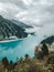 Clear blue alpine lake Schlegais with bright colors and mountain peaks in the background, overcast, Schlegais, Zillertal