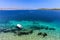 Clear blue beach at Korcula Croatia with boat