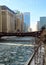 Clear blue day reflects on an ice chunk covered, frozen Chicago River.