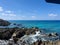 The clear blue ocean off of turtle reef in Cayman Islands on a beautiful blue sky day