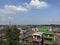 The clear blue sky above the dense village