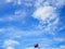 Clear blue sky with clouds and Thailand flag