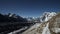 Clear blue sky over glacial severe mountains. Tranquil panorama. Timelapse