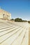 Clear blue sky and sun-bleached steps of a classic building