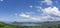 Clear blue sky white clouds, trees, natural grass trees around the Srinakarin Reservoir, Kanchanaburi, Thailand