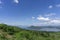 Clear blue sky white clouds, trees, natural grass trees around the Srinakarin Reservoir, Kanchanaburi, Thailand