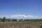 Clear blue sky white clouds, trees, natural grass trees around the Srinakarin Reservoir, Kanchanaburi, Thailand