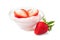 Clear bowl of strawberry yogurt with fresh berries over white