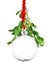 Clear Christmas ornament hanging by red ribbon rope with the bauble surrounded with green mistletoe