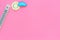 Clear and cloudly weather concept. Air temperature. Termometer near sun on pink background top view copy space