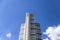 Clear cloudy blue sky in the background in summertime and modern luxury high-rise apartment buildings