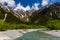 Clear, cold river running through a forested valley. River Azusa, Kamikochi, Japan