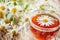 A clear Cup of medicinal chamomile tea on an old wooden table. Health and healthy lifestyle concept