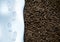 Clear deep footprints on white winter snow of a pair of boots. Track in snow. Overhead view. Image of soil texture
