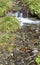 Clear fresh mountain water over stones