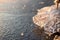 Clear ice icicle close-up sparkling on frozen lake