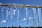 Clear icicles against blue sky