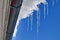 Clear icicles hanging from the roof