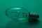 Clear Incandescent Night Light Bulb with candelabra base on green