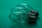 Clear Incandescent Night Light Bulb with candelabra base on green