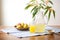 clear jug on table surrounded by fresh mangoes