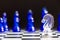 Clear knight chess piece face with blue team on black background