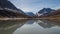 Clear lake between high mountains with milky shade. Sunny day, autumn. Altai region. Half frame.