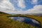 Clear lke, clouds and Svydovets ridge.