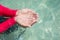 Clear natural water in woman hand.