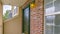 Clear Panorama Facade of a home with a small porch and classic red brick wall